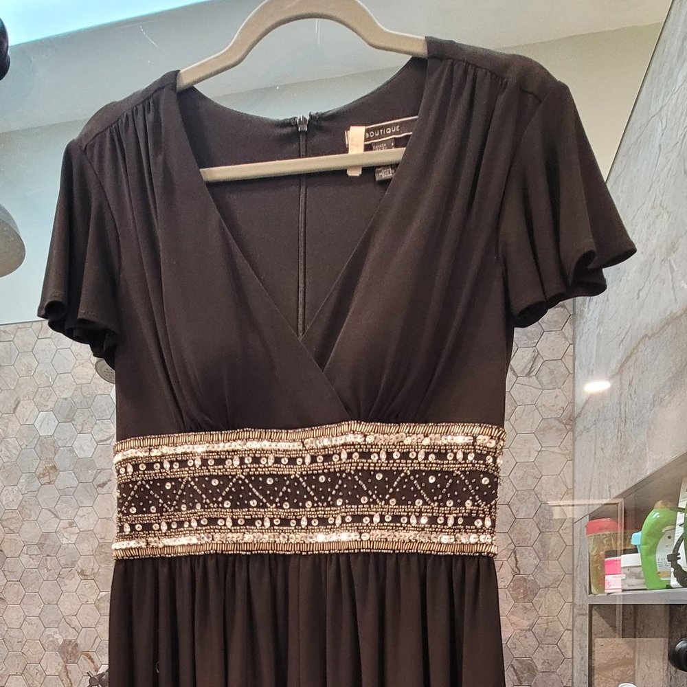 Black and silver flutter sleeve midi dress with fitted sequin waist